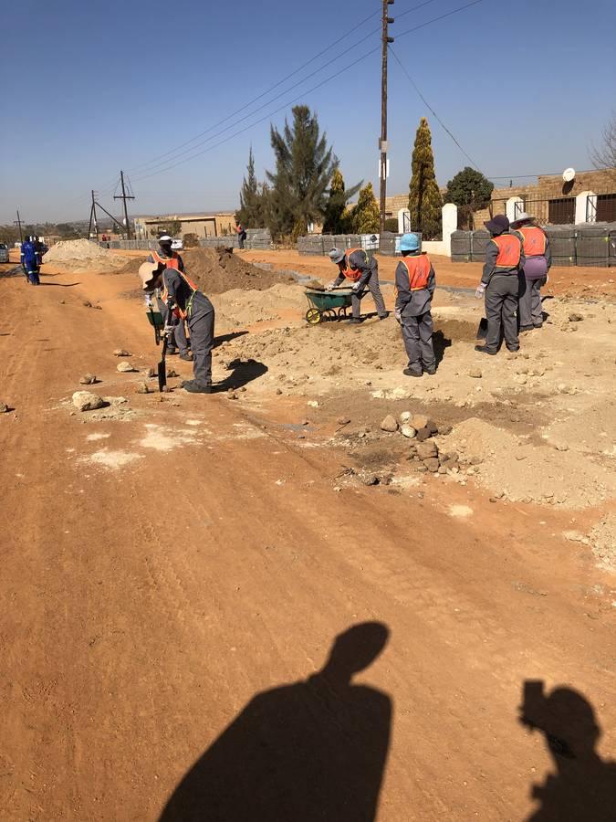 Local labour team building the road