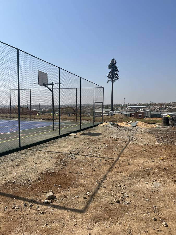 Courts with earthworks continuing alongside