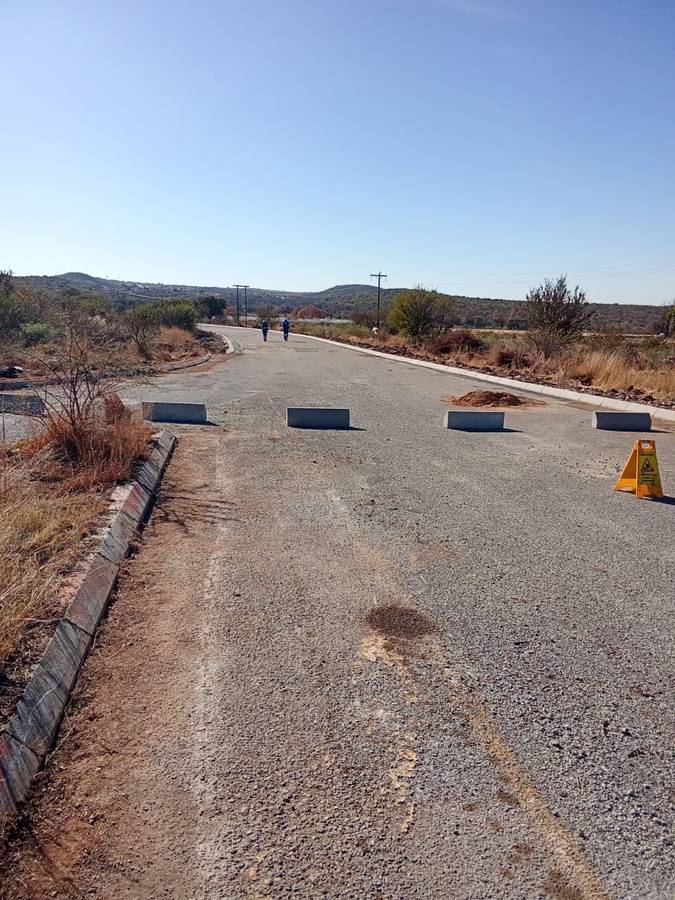 Road closed with concrete barriers